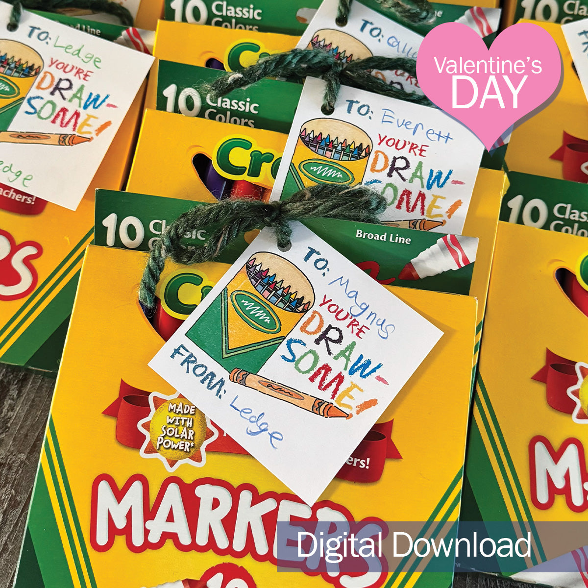 You’re Draw-some printable Valentine tag attached to a box of colorful markers