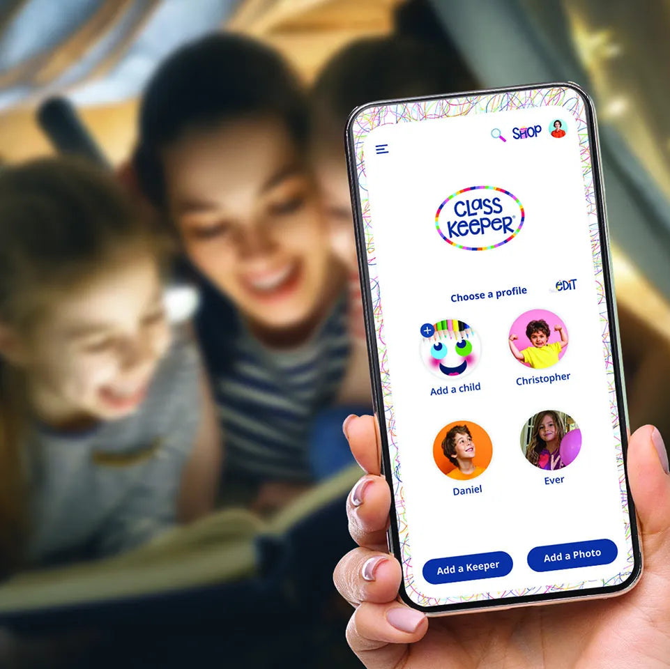 Person holding a smartphone displaying the 'Class Keeper' app with children in the background.