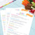 Sheet of paper with 'Kids' Snack & Lunch Box Ideas' on a blue surface with snacks.